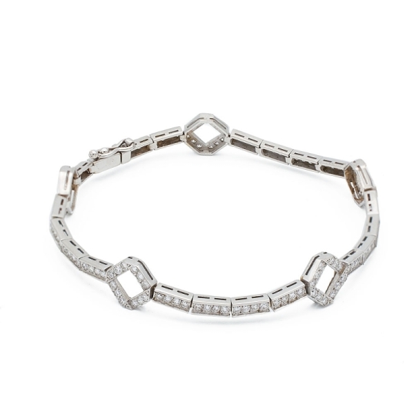 Pulsera semirígida de oro blanco y diamantes - 1210 Pulsera realizada en oro blanco de 18k con pequeñas piezas rectangulares enl